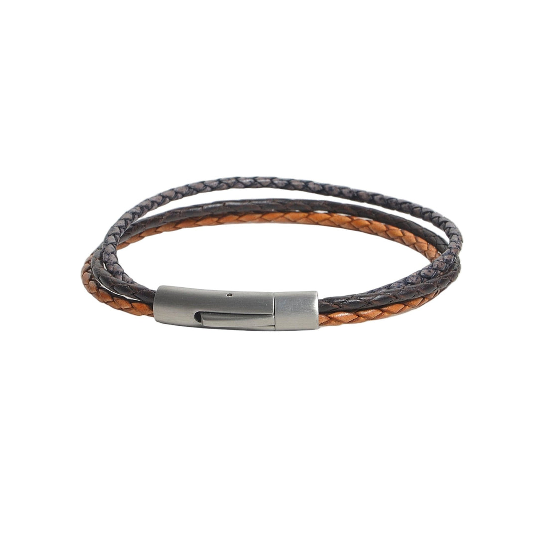 Bracelet with brown and black braided design on a light gray background